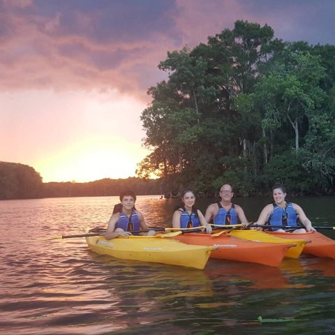 Family of kayakers paddling Black River in Myrtle Beach, SC