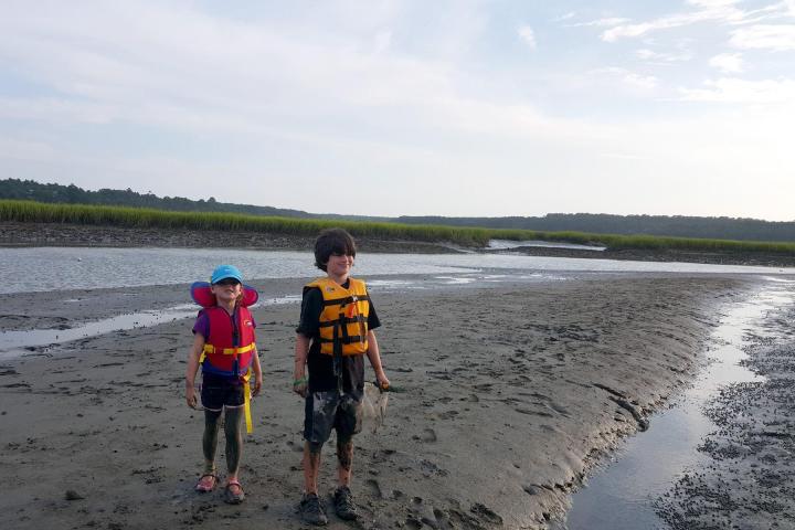 Two children exploring a beach before kayaking in Myrtle Beach, SC