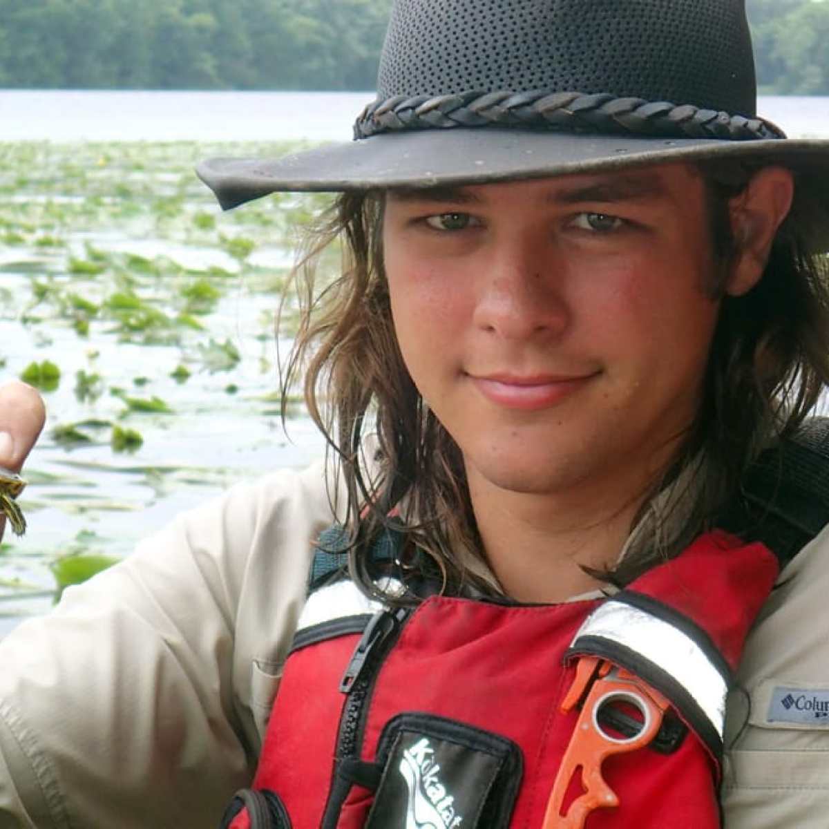 Kayaker holding baby turtle in Myrtle Beach, SC